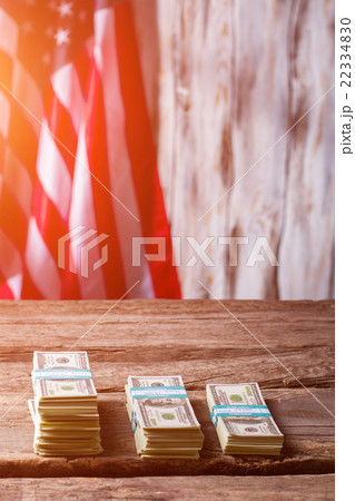 American flag and dollar bundles. 22334830