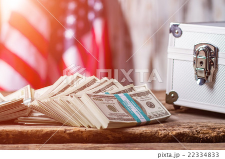 Dollars, case and USA flag. 22334833