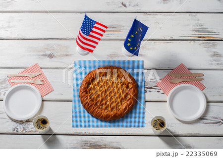 Flags beside pie and plates. 22335069