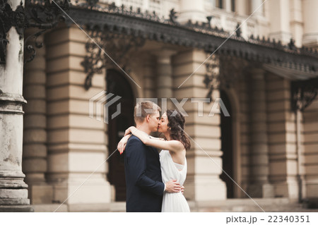 Beautiful wedding couple, bride, groom kissing and 22340351