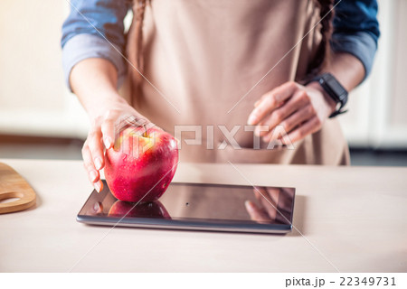 Pleasant  woman standing in the kitchen  22349731