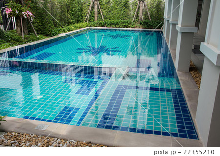 Residential swimming pool in backyard 22355210