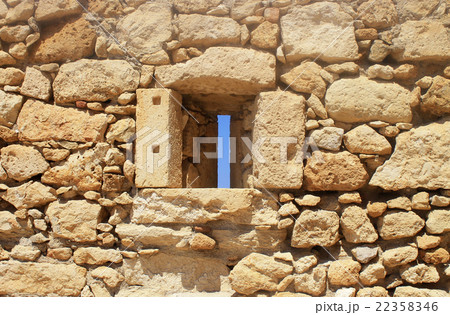 Window in old stone wall ruins 22358346