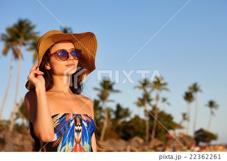 Woman in sunglasses on a beach 22362261