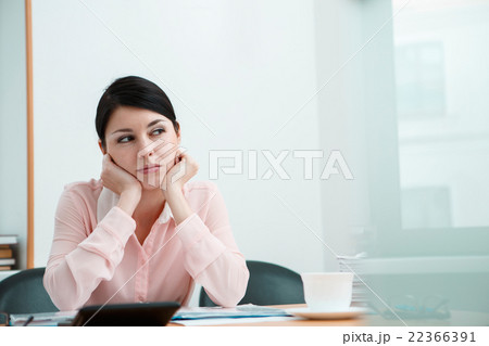 Beautiful woman dreaming at working place Beautiful woman dreaming at working place 22366391