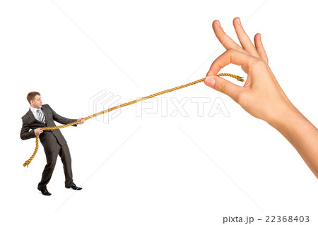 Businessman pulling rope against big woman hand Businessman pulling rope against big woman hand 22368403