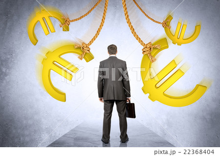 Businessman looking on euro signs Businessman looking on euro signs 22368404