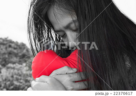black and white women hug red heart 22370617