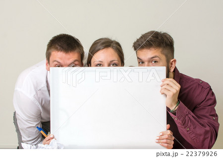 Team hiding behind white board Team hiding behind white board 22379926
