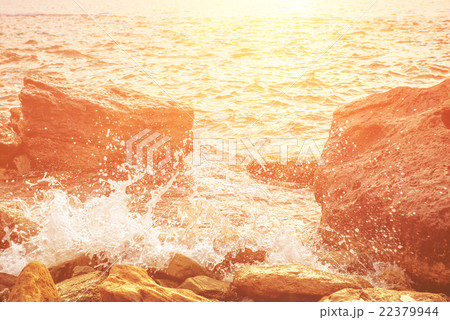Sea splashing on rocks 22379944