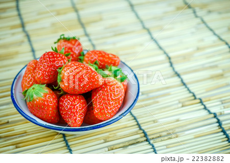 Ripe red strawberries in iron bowl  22382882