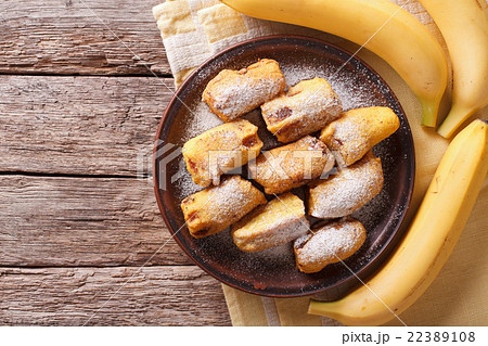 Fried bananas in batter on a plate. top view 22389108