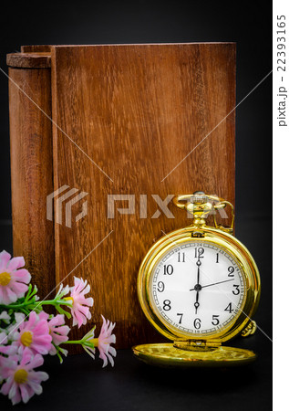 Wood book cover with golden pocket watch. Wood book cover with golden pocket watch. 22393165