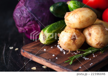 Young potatoes on wooden table  22396846
