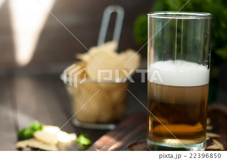 Mug of beer on wooden background 22396850