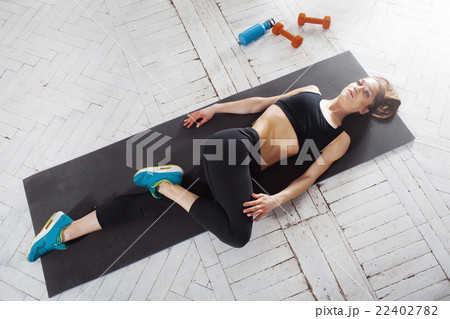 Beautiful slim brunette  doing some stretching 22402782