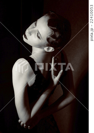 beauty blond woman in studio black and white, old 22410053