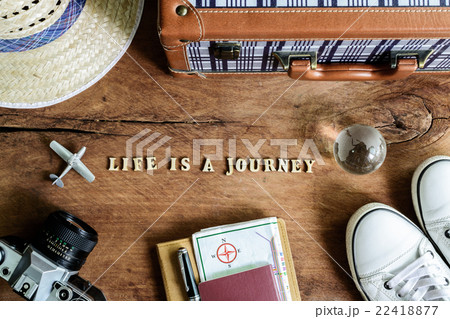 Outfit of traveler on wooden background Outfit of traveler on wooden background 22418877