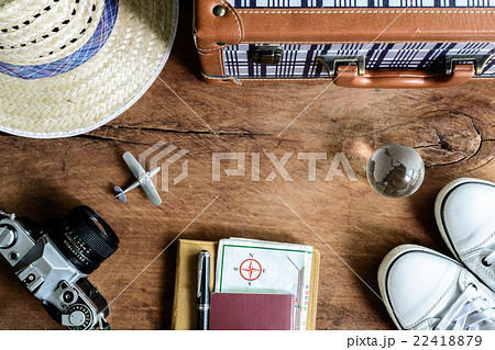 Outfit of traveler on wooden background Outfit of traveler on wooden background 22418879