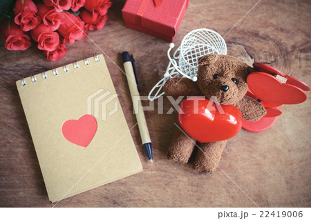 Teddy bear with red heart shape and notebook Teddy bear with red heart shape and notebook 22419006