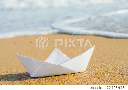 white paper boat on beach white paper boat on beach 22423993