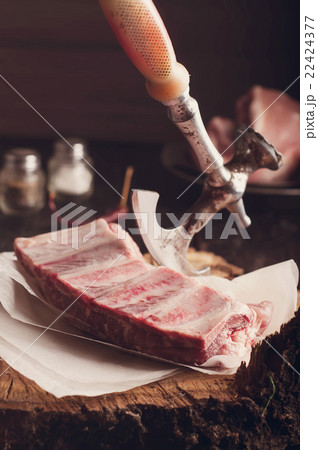 Raw ribs on a wooden table Raw ribs on a wooden table 22424377