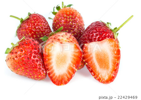 Strawberries and cut strawberry on white Strawberries and cut strawberry on white 22429469