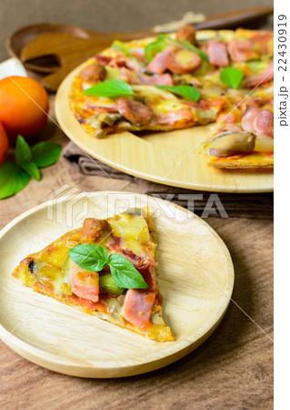 Rustic pizza with becon, salami and basil Rustic pizza with becon, salami and basil 22430919