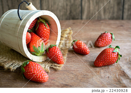 Fresh strawberries on rustic wooden table 22430928