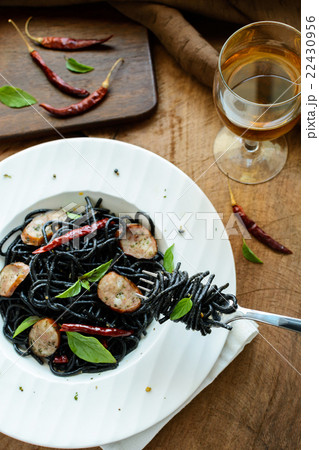 Black spicy spaghetti with sausage and chilli Black spicy spaghetti with sausage and chilli 22430956