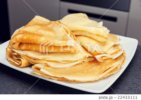 Sweet pancake on white plate 22433111