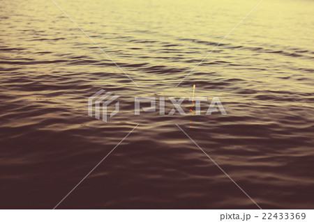 Water and bobber at evening. 22433369
