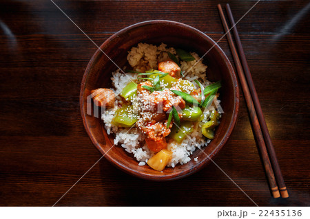 Rice in sauce with stir fried vegetables, salmon. Rice in sauce with stir fried vegetables, salmon. 22435136