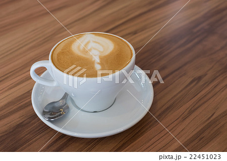 A cup of art latte coffee on table in cafe A cup of art latte coffee on table in cafe 22451023