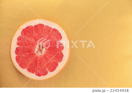 red grapefruit on a gold background 22454938