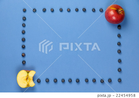 Apple with frame of blueberries 22454958