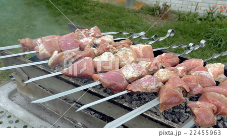 Barbeque skewers with meat cooking on brazier Barbeque skewers with meat cooking on brazier 22455963