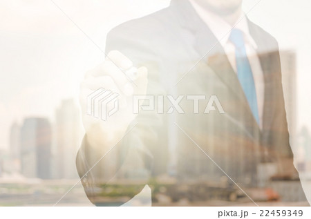 Double exposure of businessman with cityscape building glass Double exposure of businessman with cityscape building glass 22459349