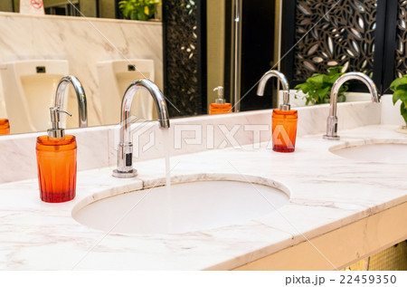 Luxury Chrome faucet with washbasin in modern toilet Luxury Chrome faucet with washbasin in modern toilet 22459350