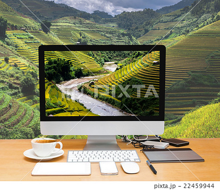 Conceptual image of a workspace with computer desktop on Rice fields on terraced of Mu Cang Chai District, YenBai province, Northwest Vietnam Conceptual image of a workspace with computer desktop on Rice fields on terraced of Mu Cang Chai District, YenBai province, Northwest Vietnam 22459944