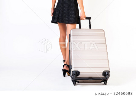 Attractive tourist woman with suitcase on isolated 22460698