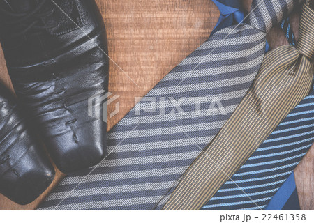Necktie and shoes on grunge wood background 22461358
