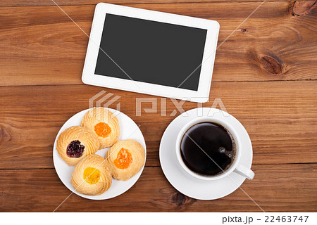 Cookies and coffee cup digital tablet computer. Cookies and coffee cup digital tablet computer. 22463747