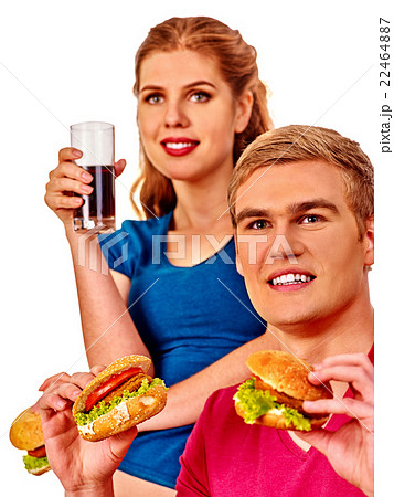Man and woman eating big sandwich with cola 22464887