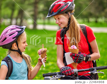 Bikes cycling girls with rucksack cycling eating Bikes cycling girls with rucksack cycling eating 22464908