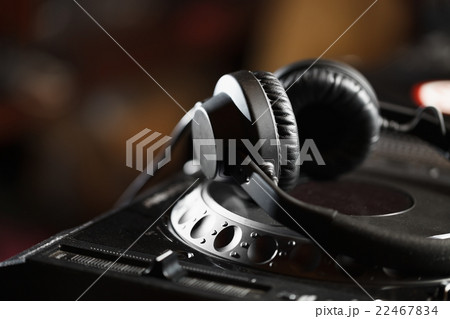 DJ headphones on CD music player DJ headphones on CD music player 22467834