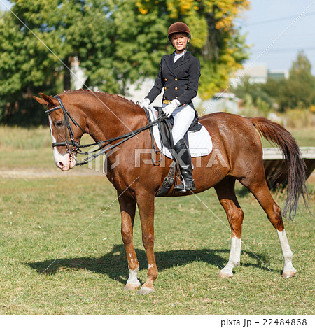 Young teenage girl riding horse. Equestrian sport Young teenage girl riding horse. Equestrian sport 22484868