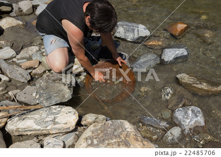 Gold Nugget mining from the River 22485706