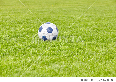 Used leather soccer ball on grass. Used leather soccer ball on grass. 22487816