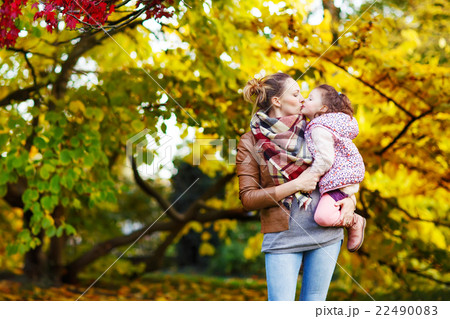 mother and her little daughter at beautiful autumn 22490083